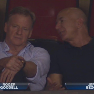 jeff bezos is going to buy the nfl isnt he roger goodell looks miserable next to bezos at nfl game internet loses it
